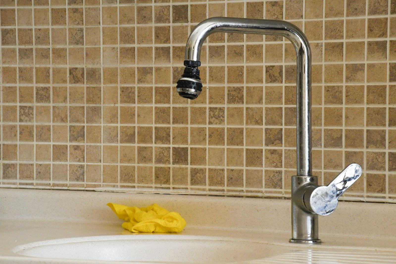 Kitchen sink and faucet ready for everyday household use.