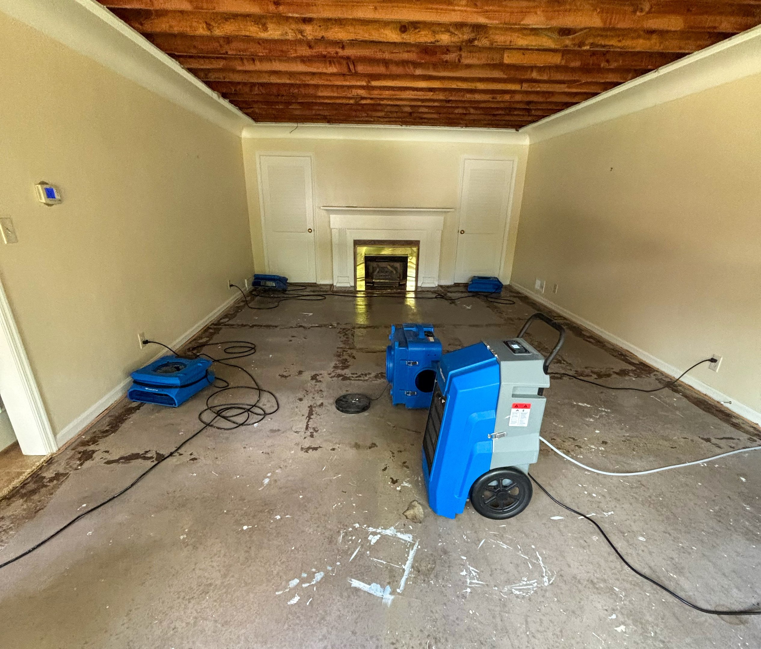 Air movers and dehumidification equipment arranged in a living room.